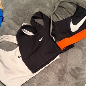 Nike size XS Black, White, and Orange Sports Bra Trio